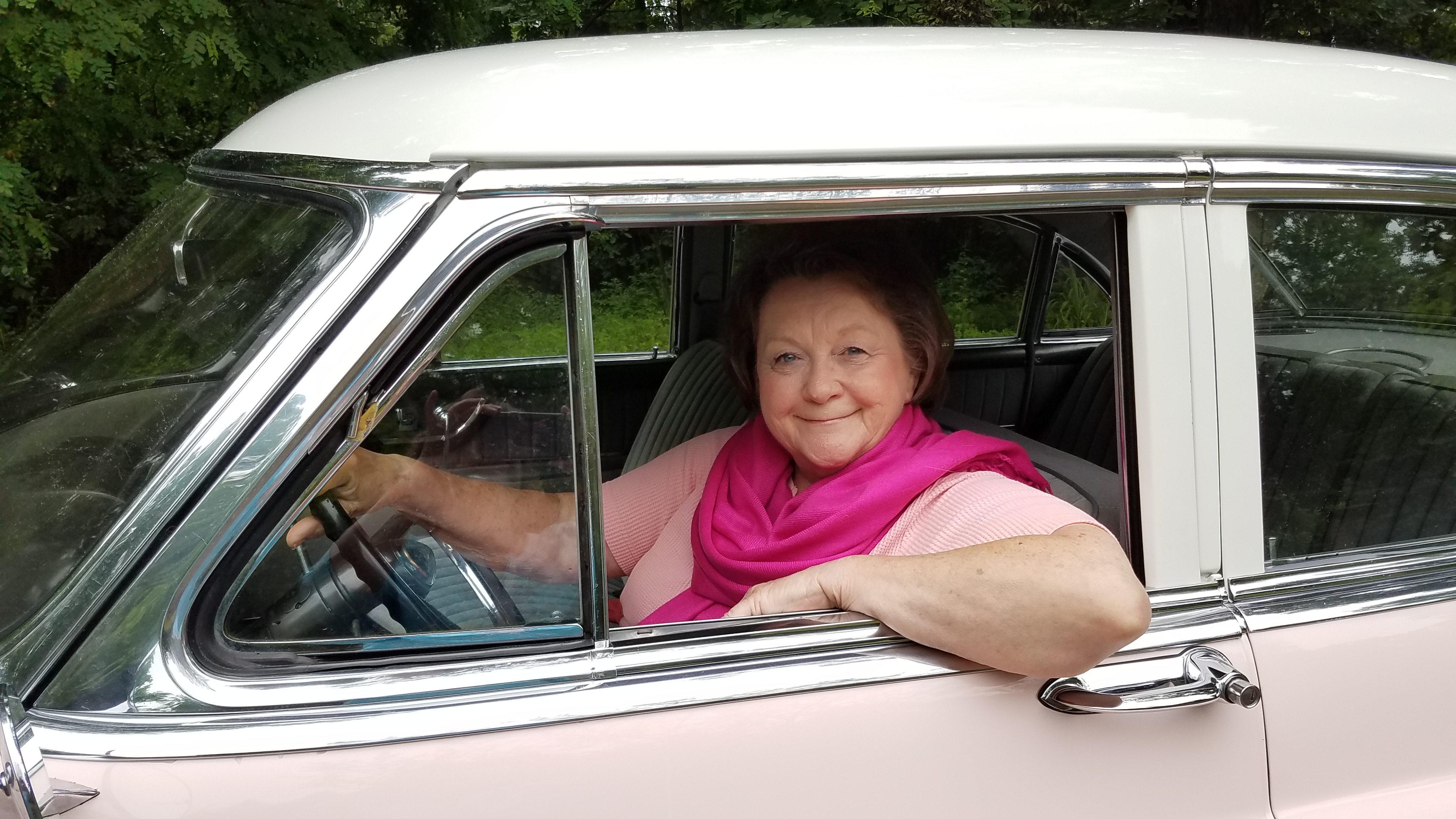 Lady in pink Cadillac