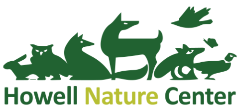 Green lettering Howell Nature Center with animal outlines.