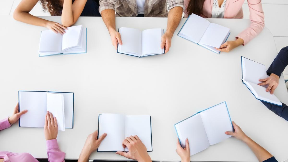 People sitting at a table in book club