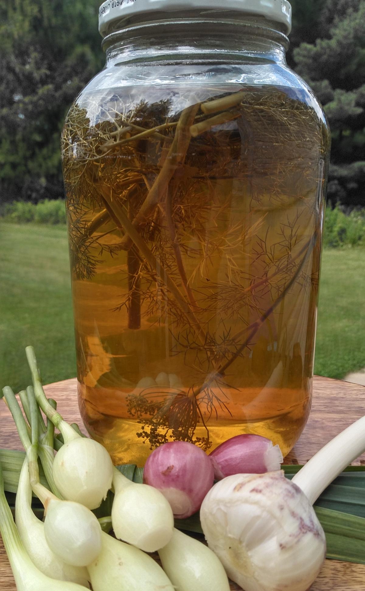 jar of gold colored vinegar