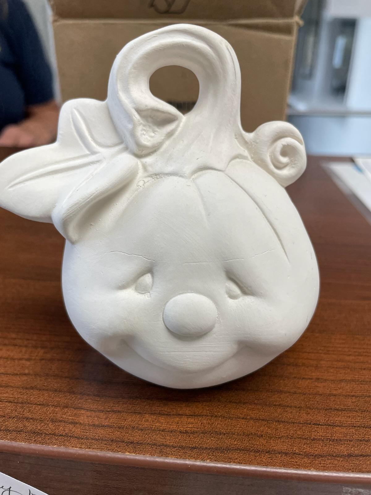 white ceramic smiling pumpkin