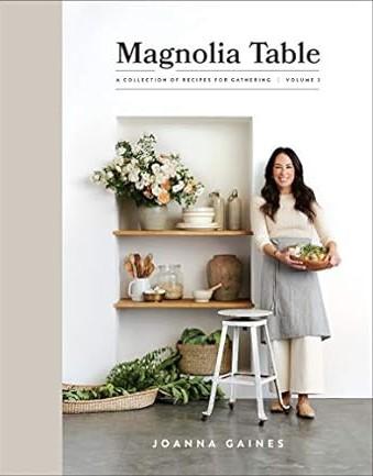 woman holding bowl of breads in a kitchen