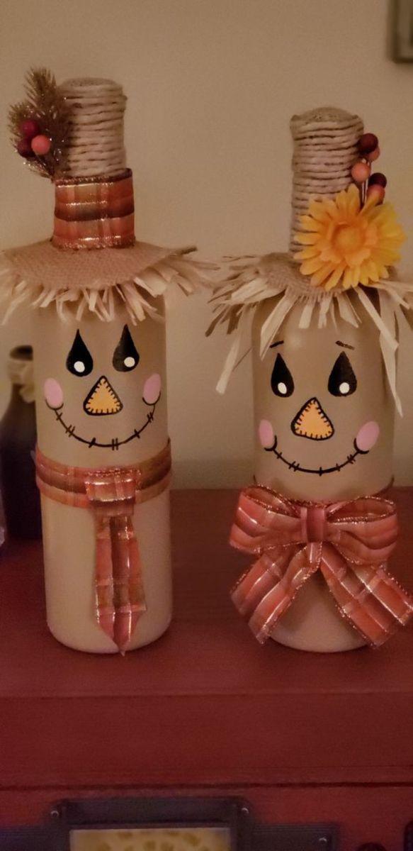 brown scarecrows made from wine bottles