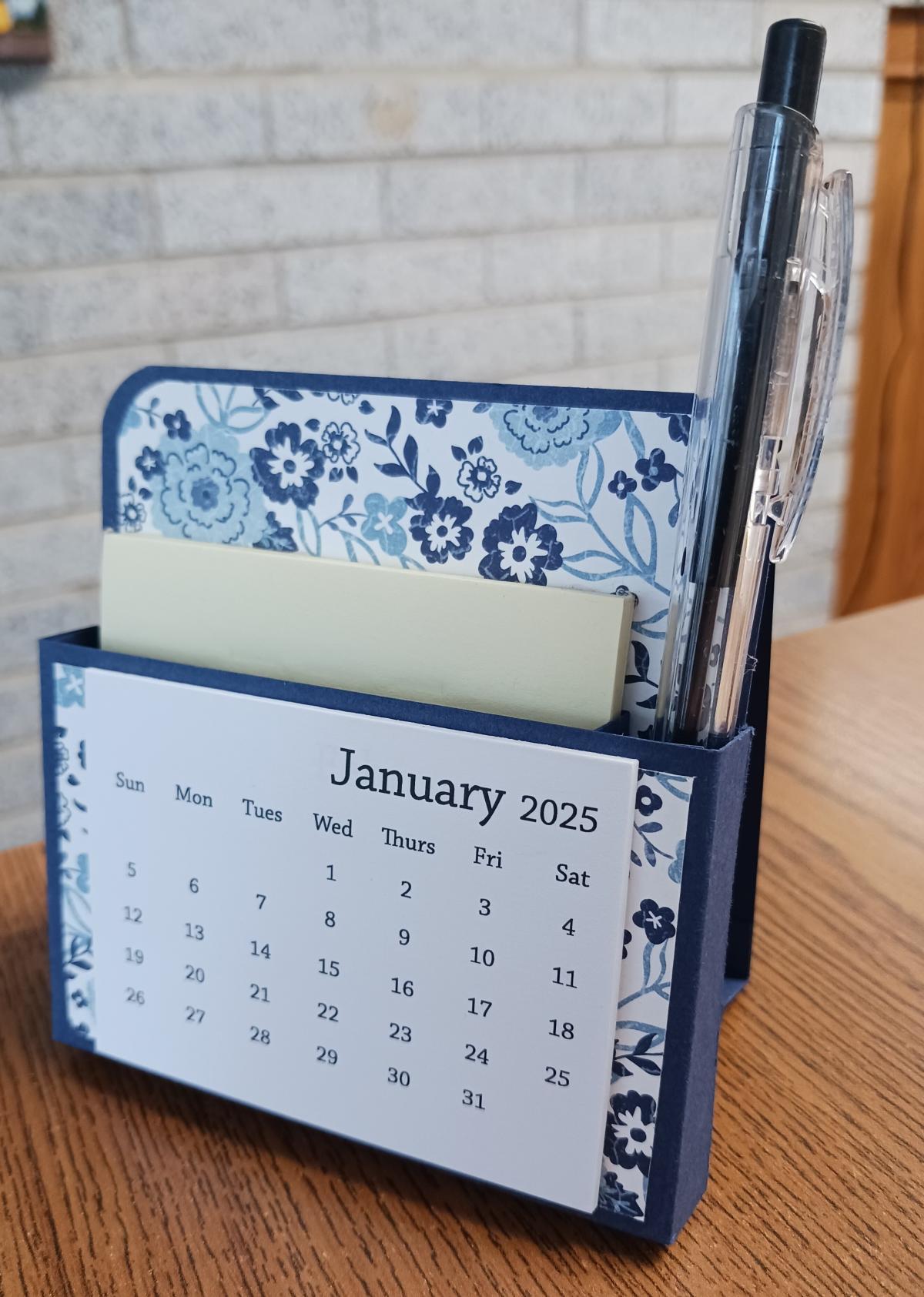 blue and white desk calendar